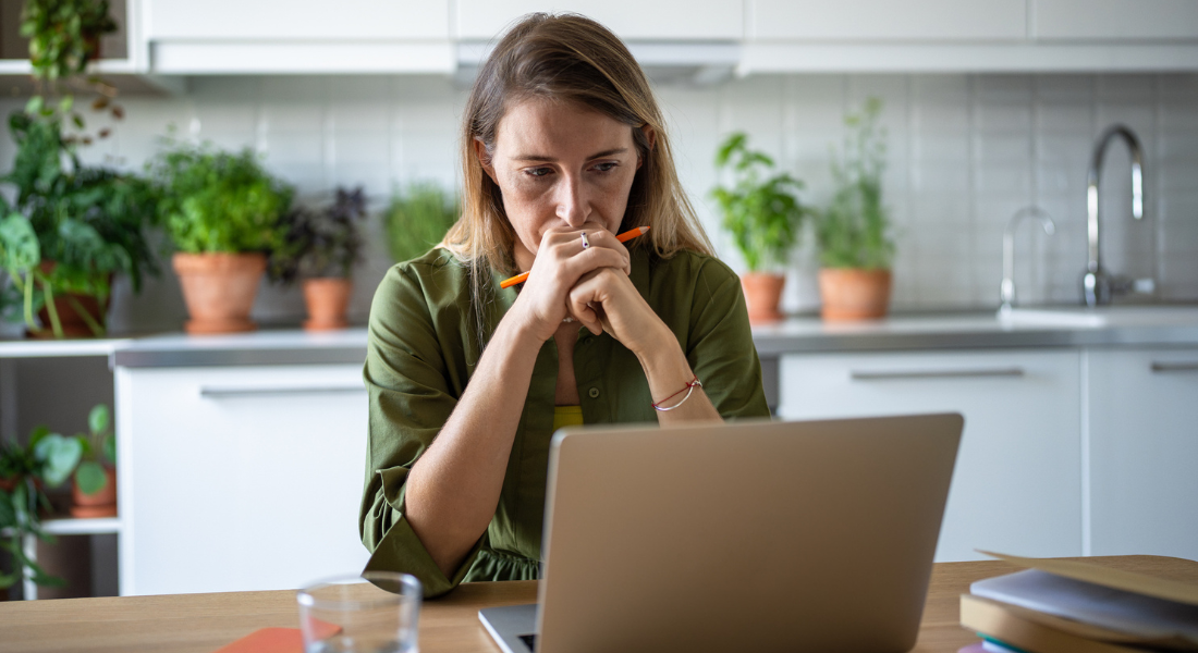 Perimenopause, Menopause & ADHD: Woman in her 40s working on her computer